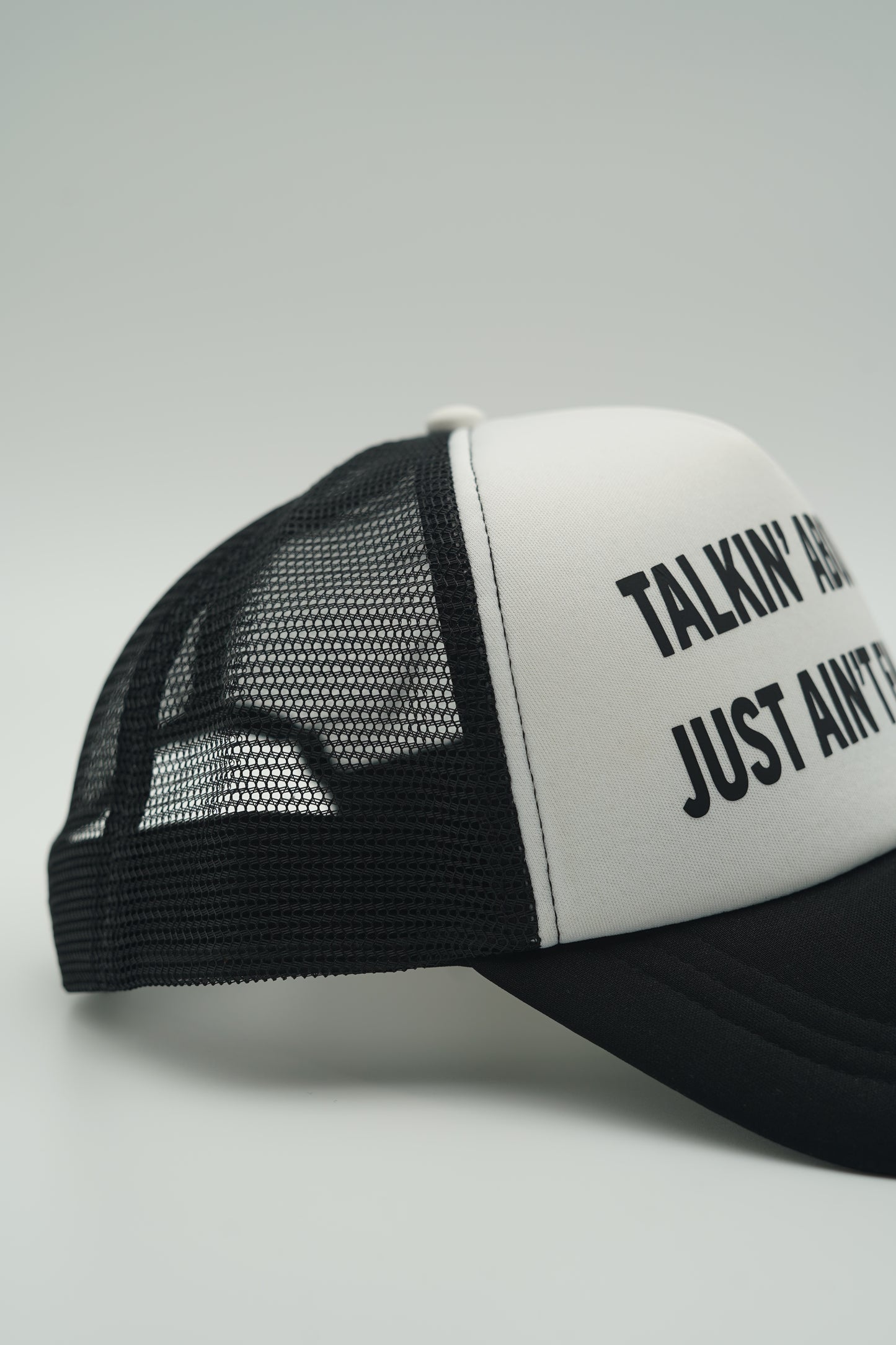 Black “The Meaning” Trucker Hat